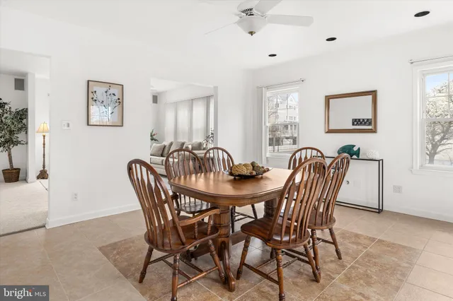 a dining room with a table and chairs