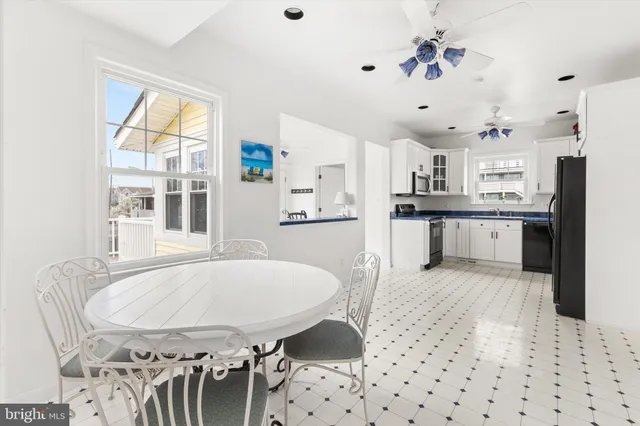 a kitchen with granite countertop a refrigerator and a sink