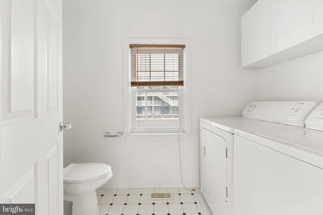 a bathroom with a sink and a window