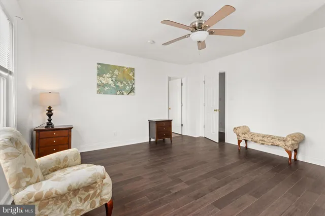 a view of empty room with a fireplace