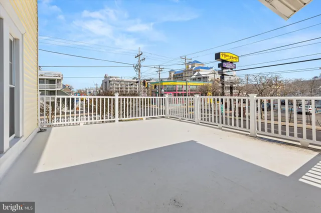 a view of a balcony with wooden floor