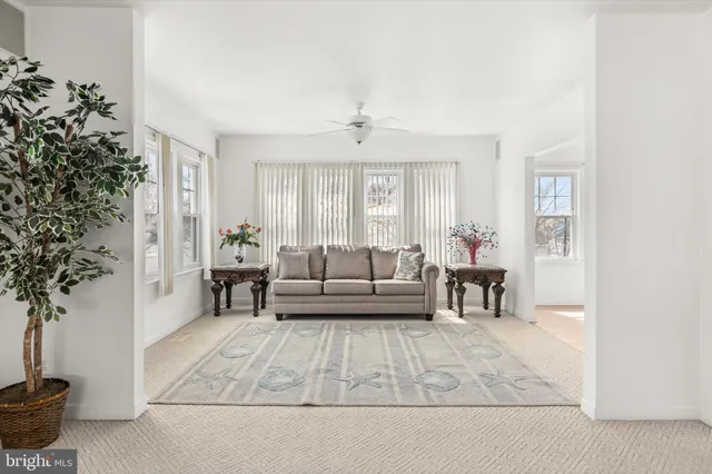 a kitchen with stainless steel appliances kitchen island granite countertop a sink and a refrigerator