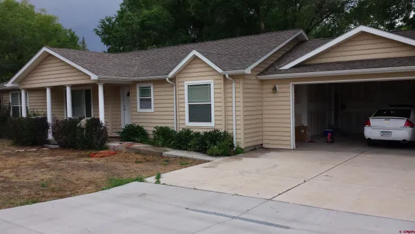 a view of a house with a yard