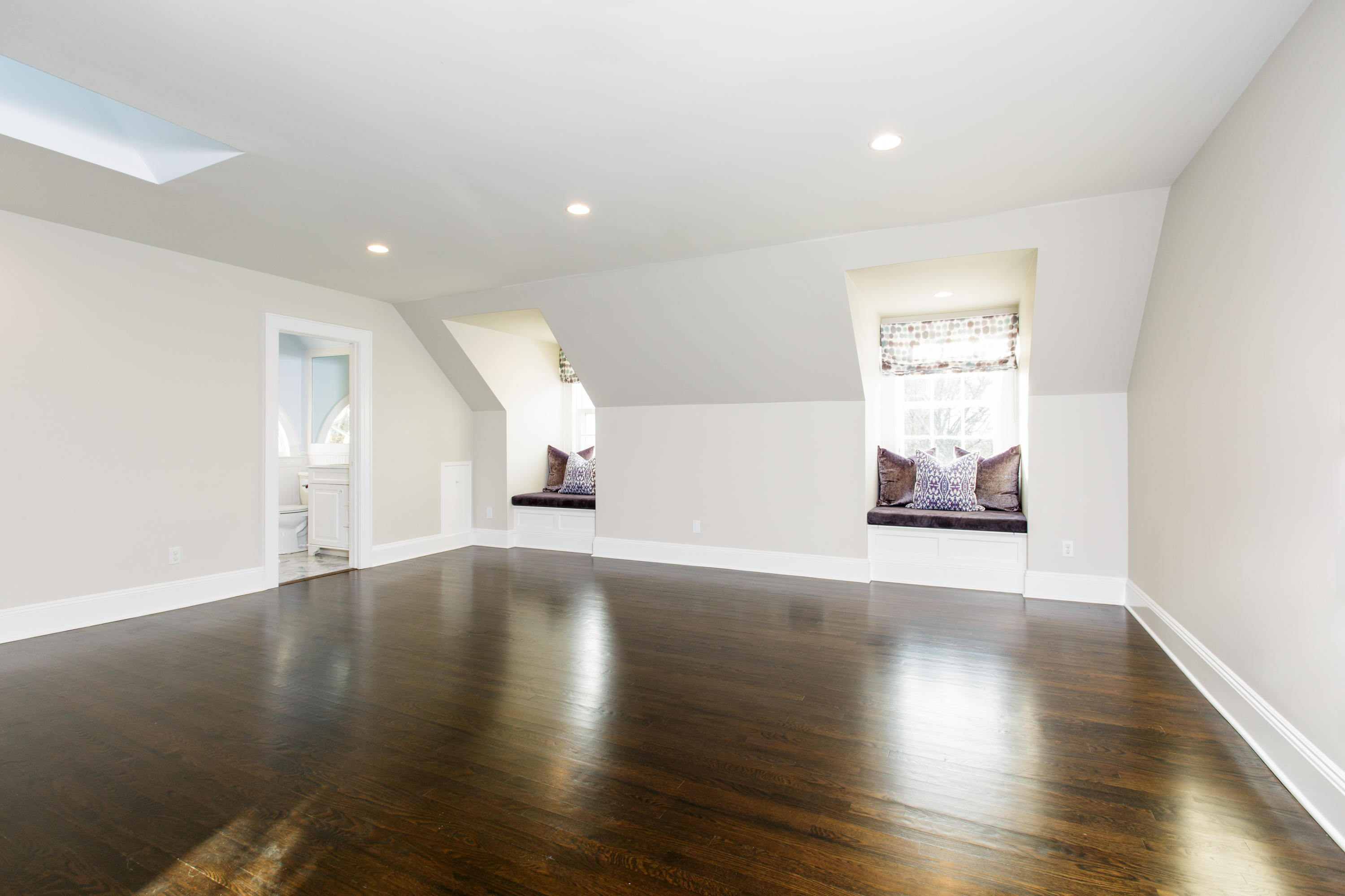 913 Ponus Ridge Road New Canaan, CT 06840 - Photo 21 of 32 an empty room with wooden floor and windows