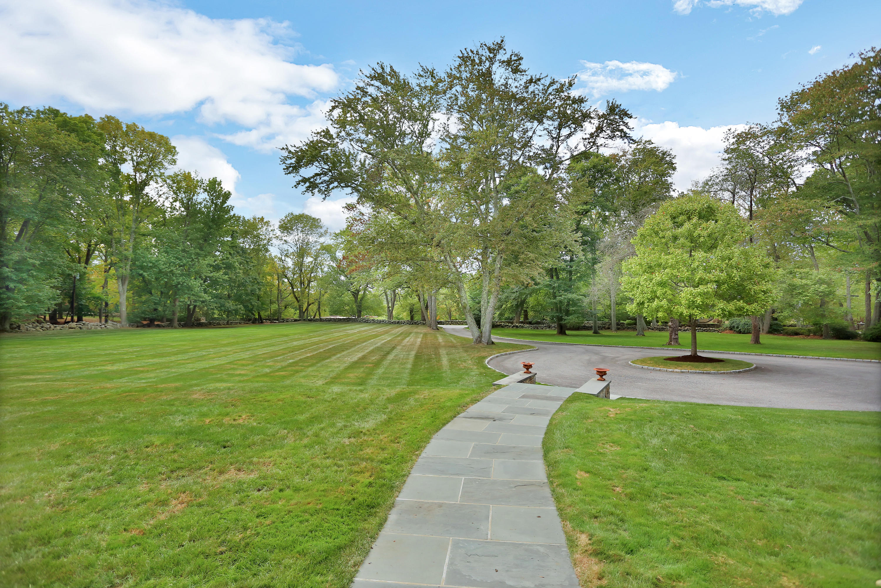 913 Ponus Ridge Road New Canaan, CT 06840 - Photo 31 of 32 a view of a swimming pool with a patio and a yard