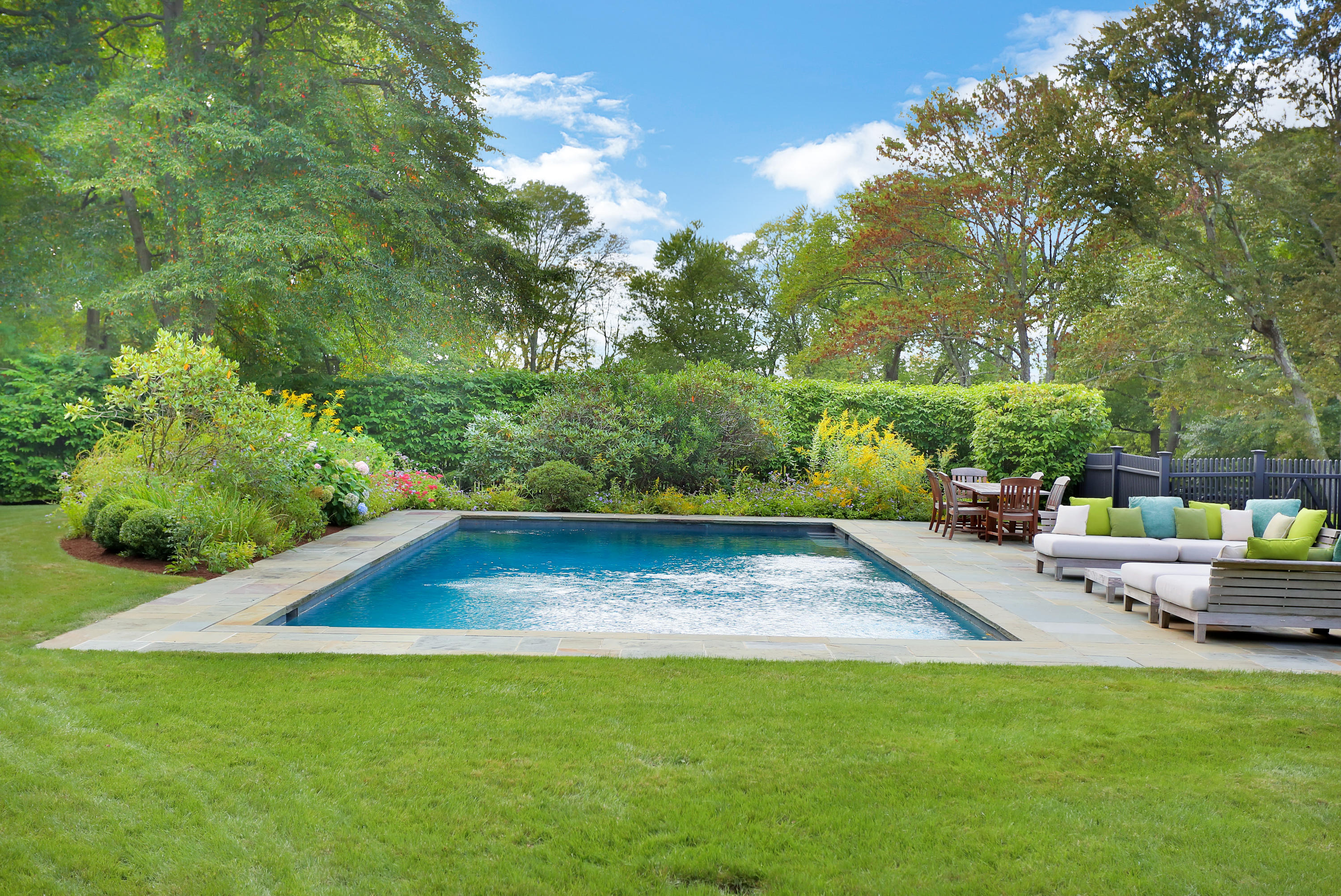 913 Ponus Ridge Road New Canaan, CT 06840 - Photo 4 of 32 a view of an outdoor space and swimming pool