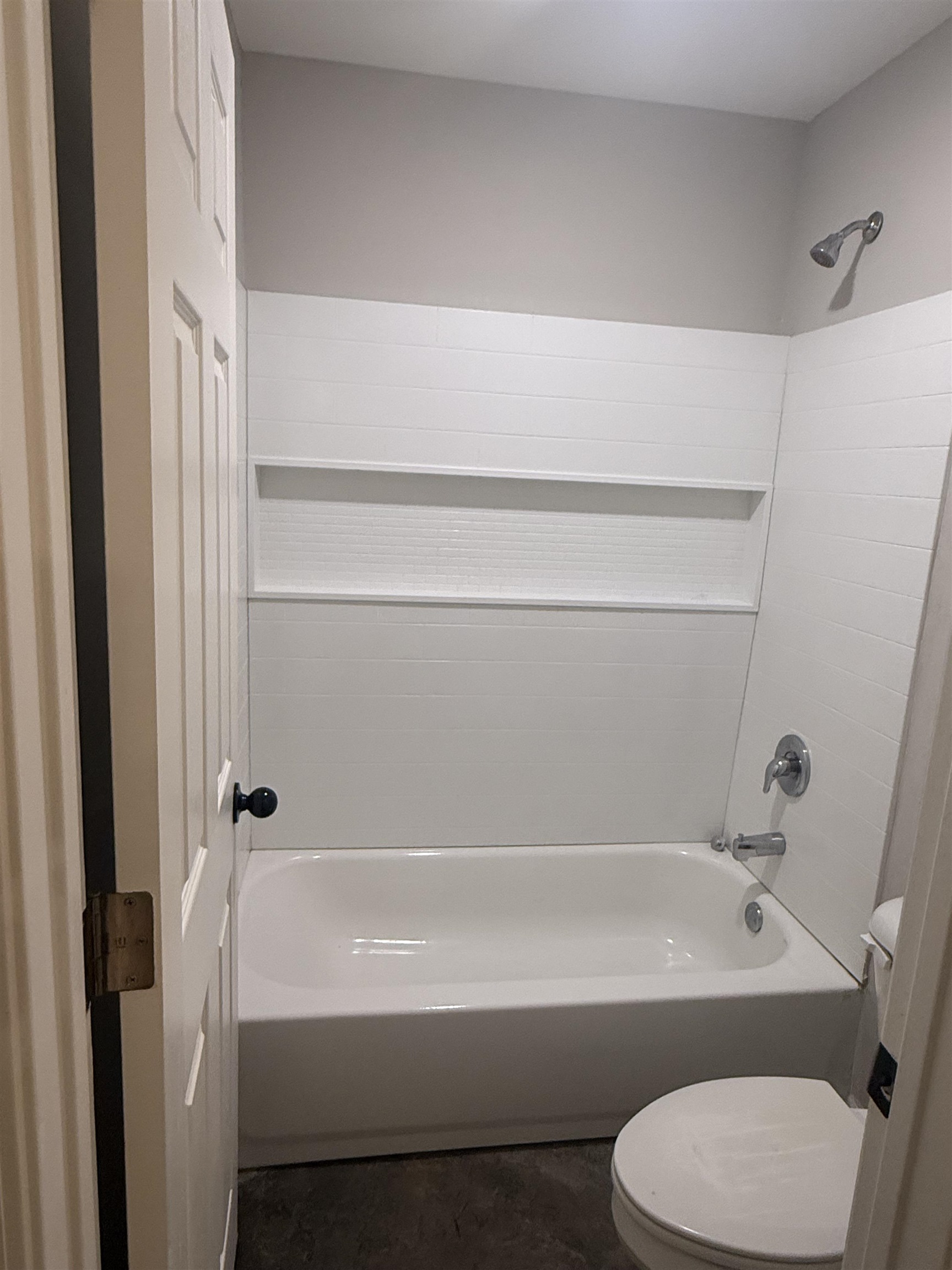 4589 Range Line Road Memphis, TN 38127 - Photo 11 of 25 a bathroom with a toilet and a bathtub