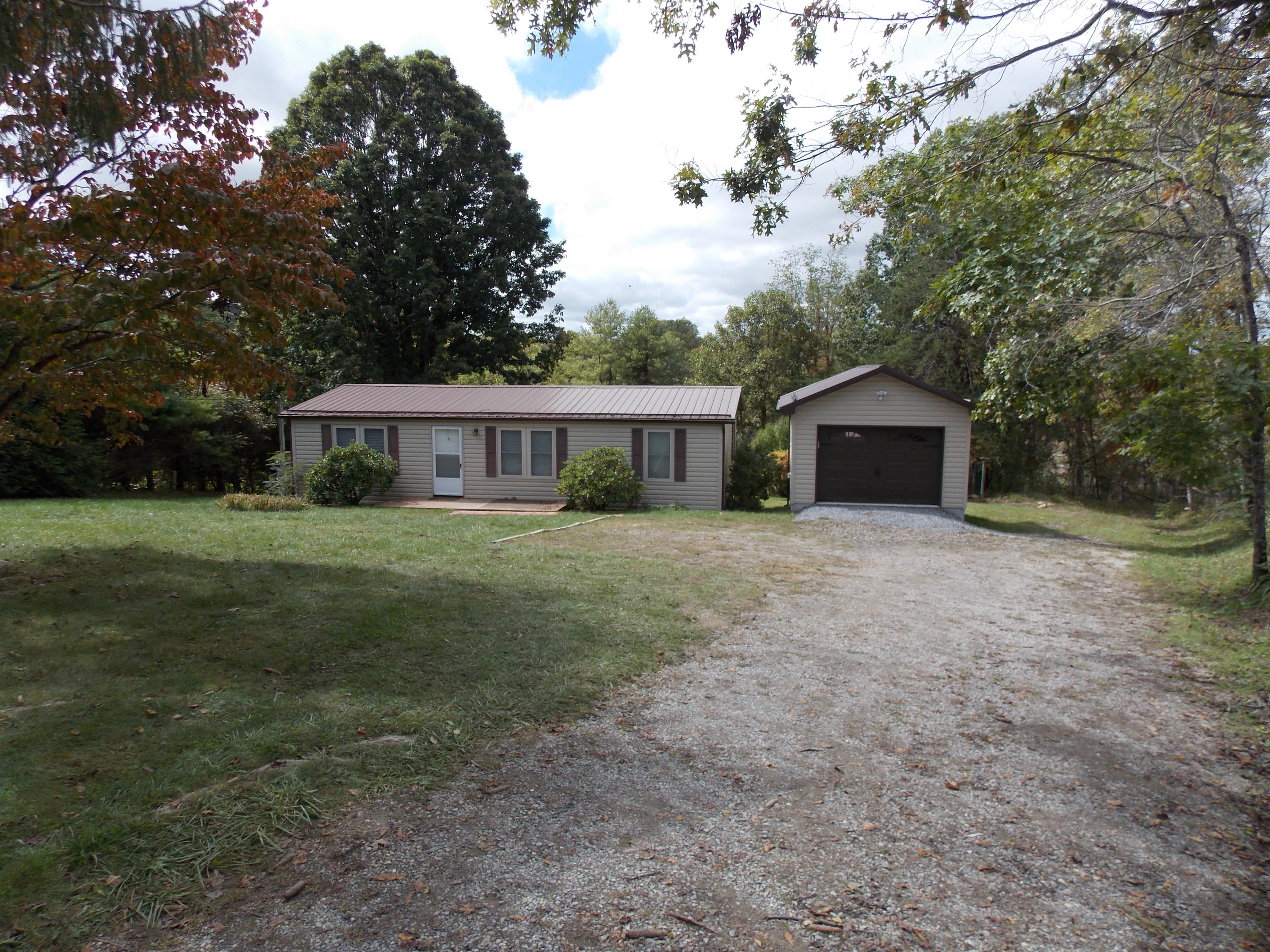 1286 Lester Road Northwest Riner, VA 24149 - Photo 1 of 25 a front view of a house with a yard
