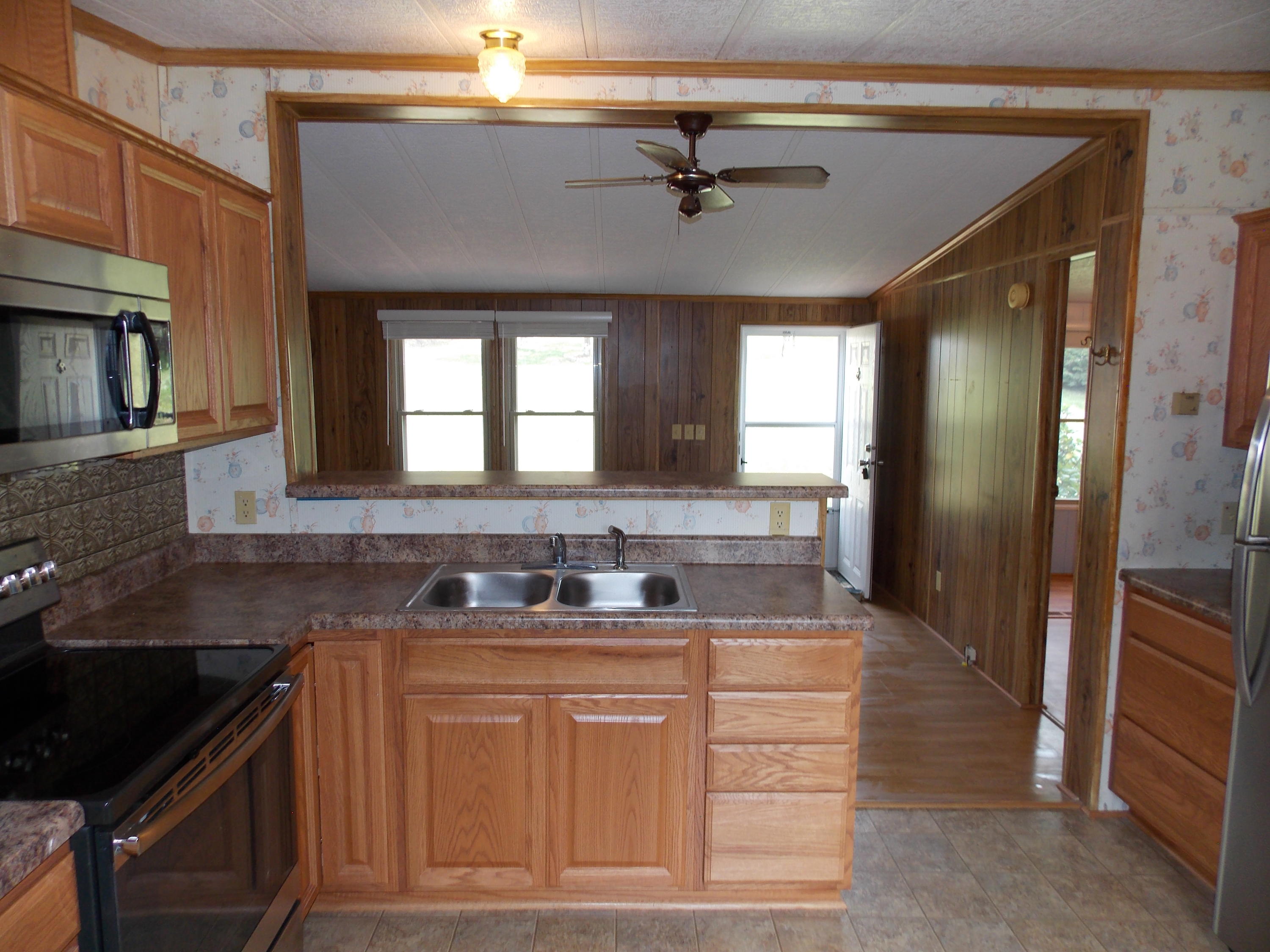 1286 Lester Road Northwest Riner, VA 24149 - Photo 14 of 25 a kitchen with stainless steel appliances granite countertop a sink and cabinets