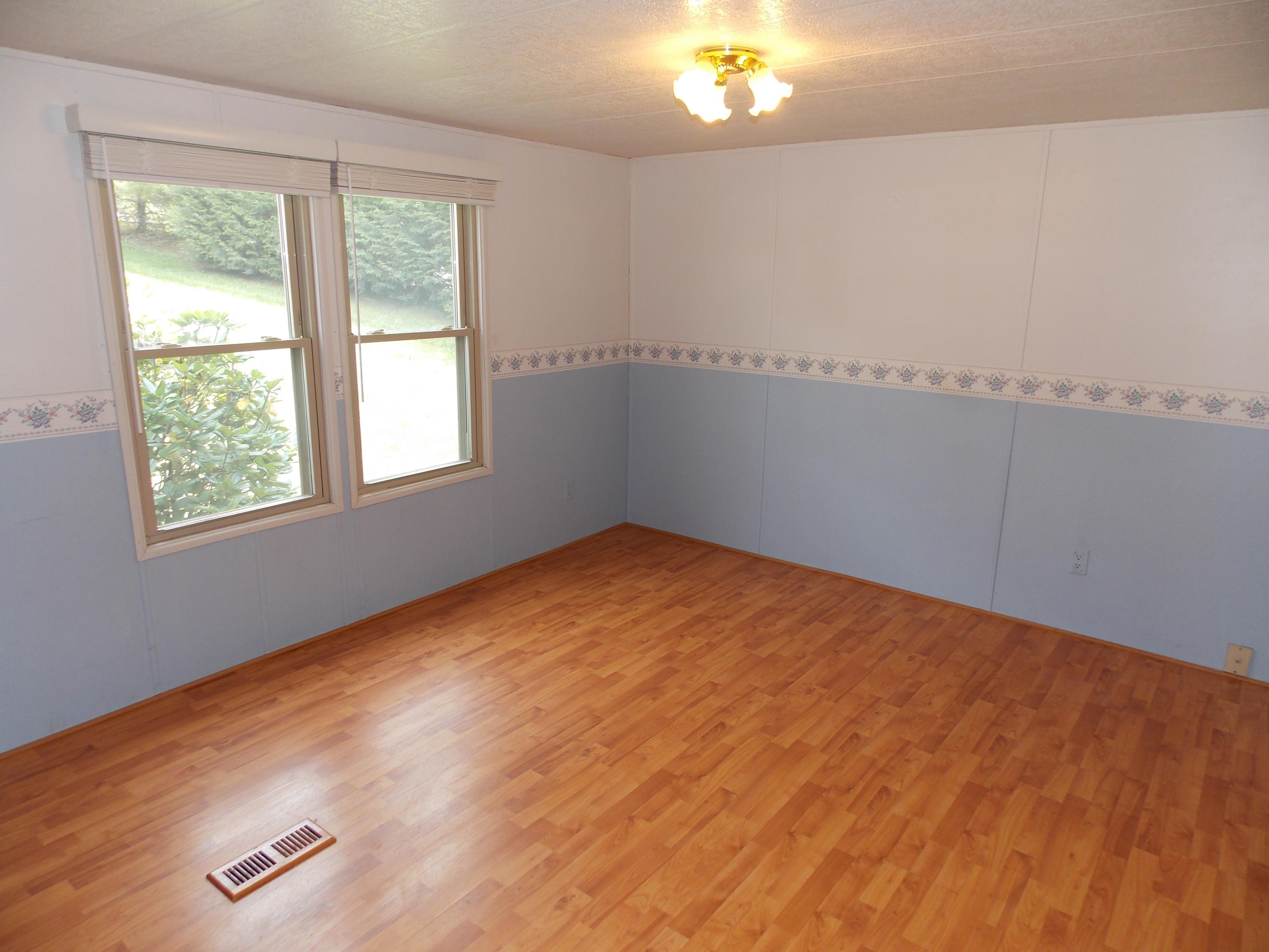 1286 Lester Road Northwest Riner, VA 24149 - Photo 16 of 25 an empty room with windows