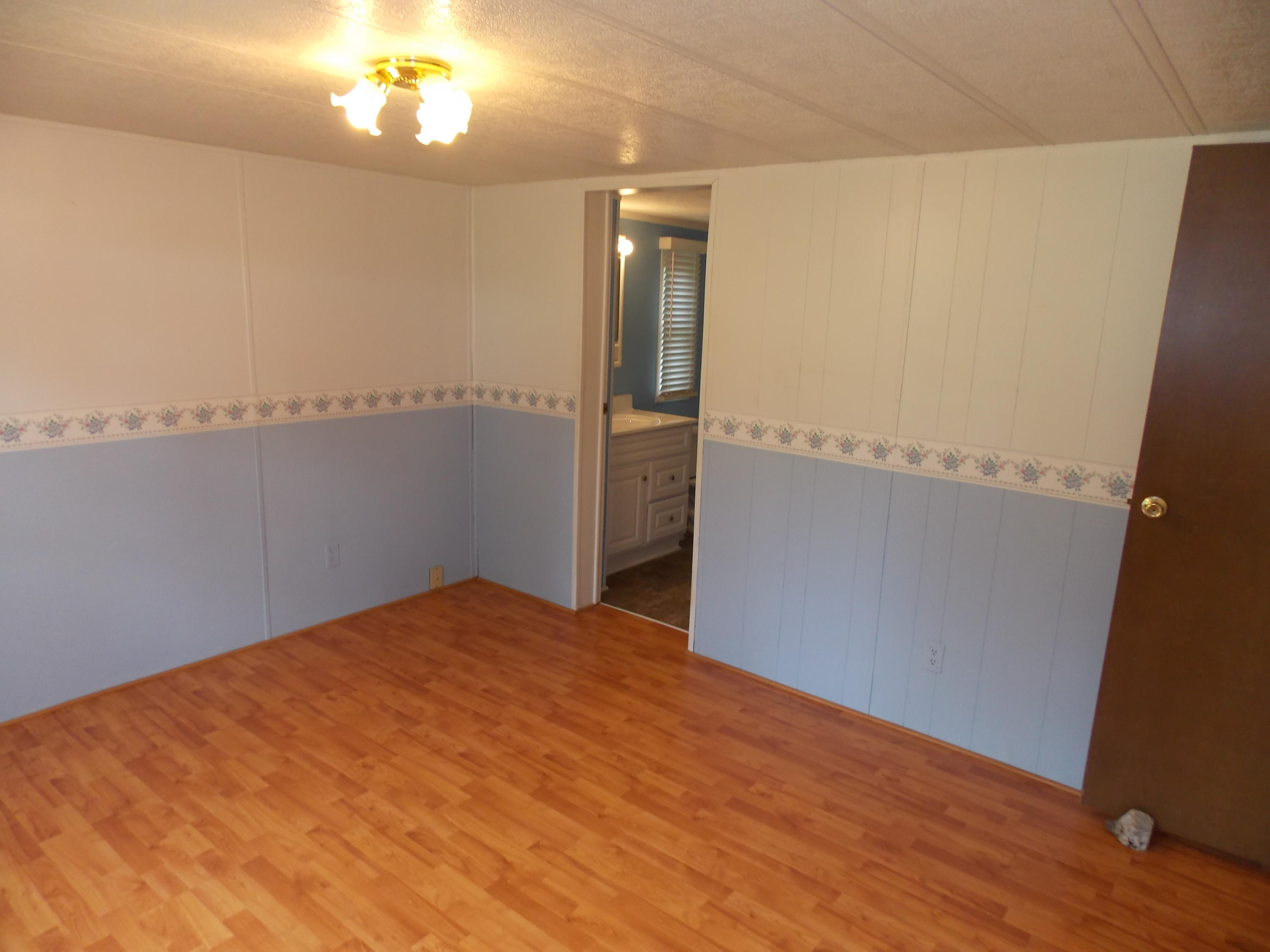 1286 Lester Road Northwest Riner, VA 24149 - Photo 17 of 25 a view of empty room with wooden floor