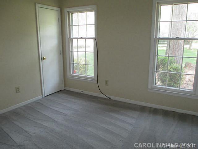 8611 Waterrock Road Charlotte, NC 28214 - Photo 5 of 8 an empty room with windows