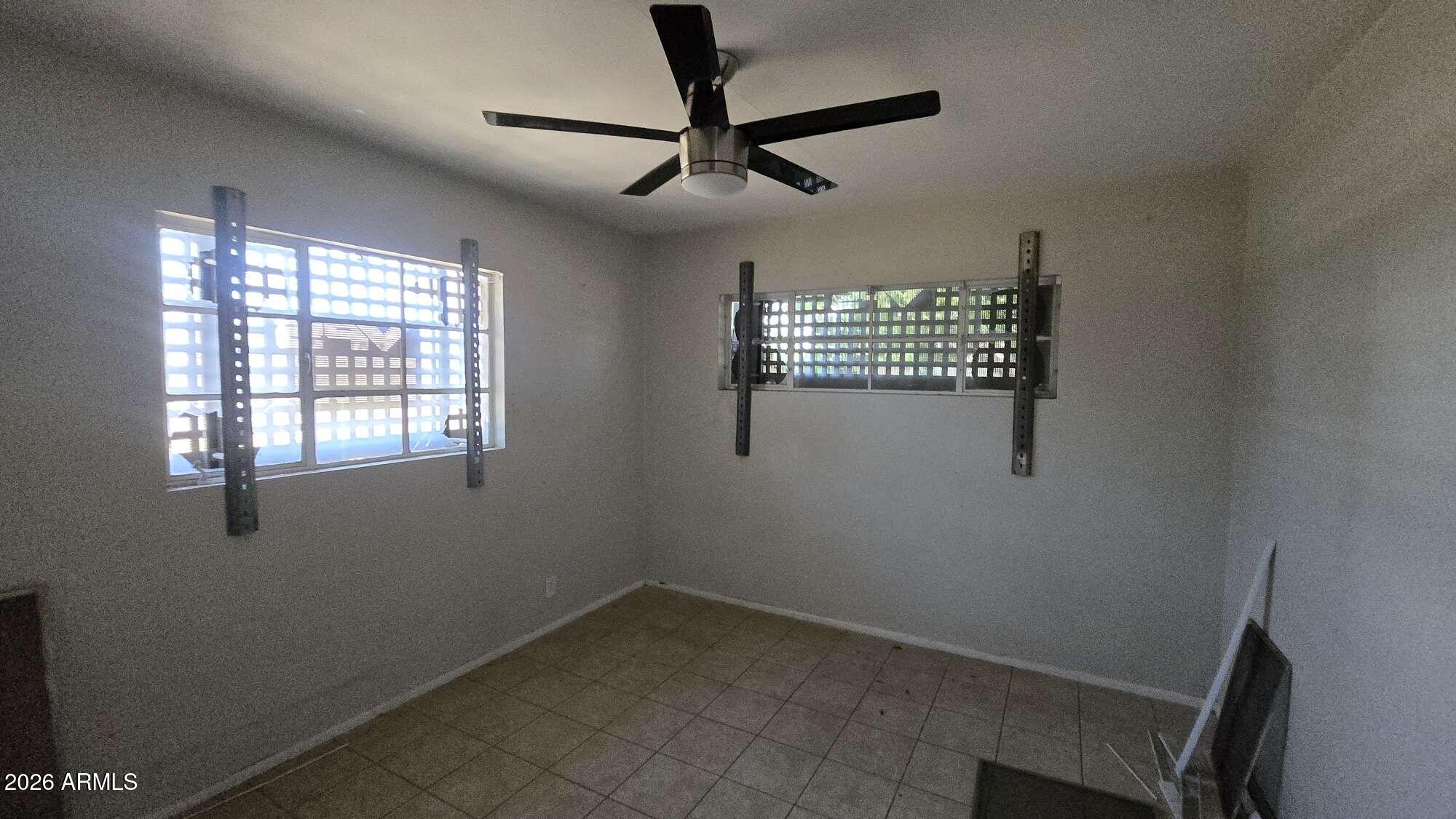 834 West Osborn Road Phoenix, AZ 85013 - Photo 10 of 45 a view of room with window and ceiling fan