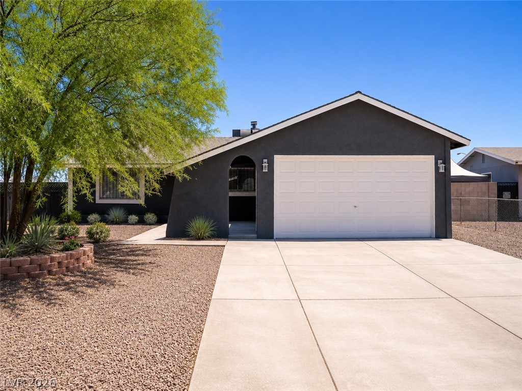 2870 South Sandhill Road Las Vegas, NV 89121 - Photo 6 of 64 A well-maintained facade with a two-car garage and mature landscaping welcomes you home.