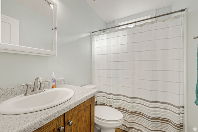 18573 South Marsh Valley Road Downey, ID 83234 - Photo 18 of 32 Full bathroom featuring vanity and a shower with curtain