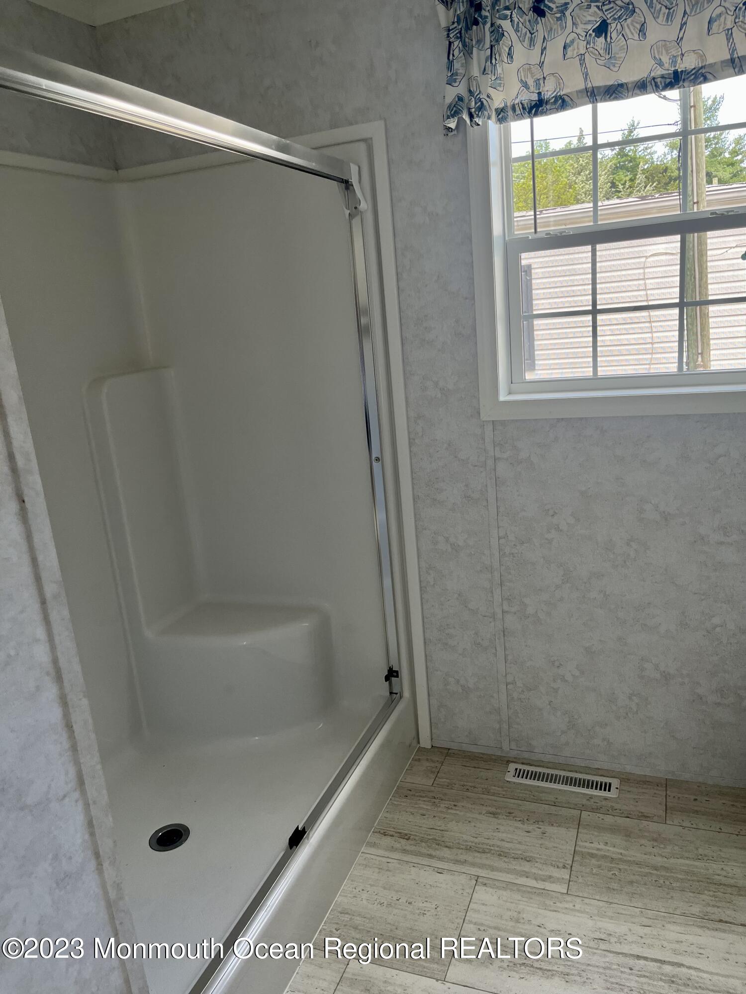 6 C Trail Brick, NJ 08724 - Photo 14 of 17 a bathroom with a glass shower door