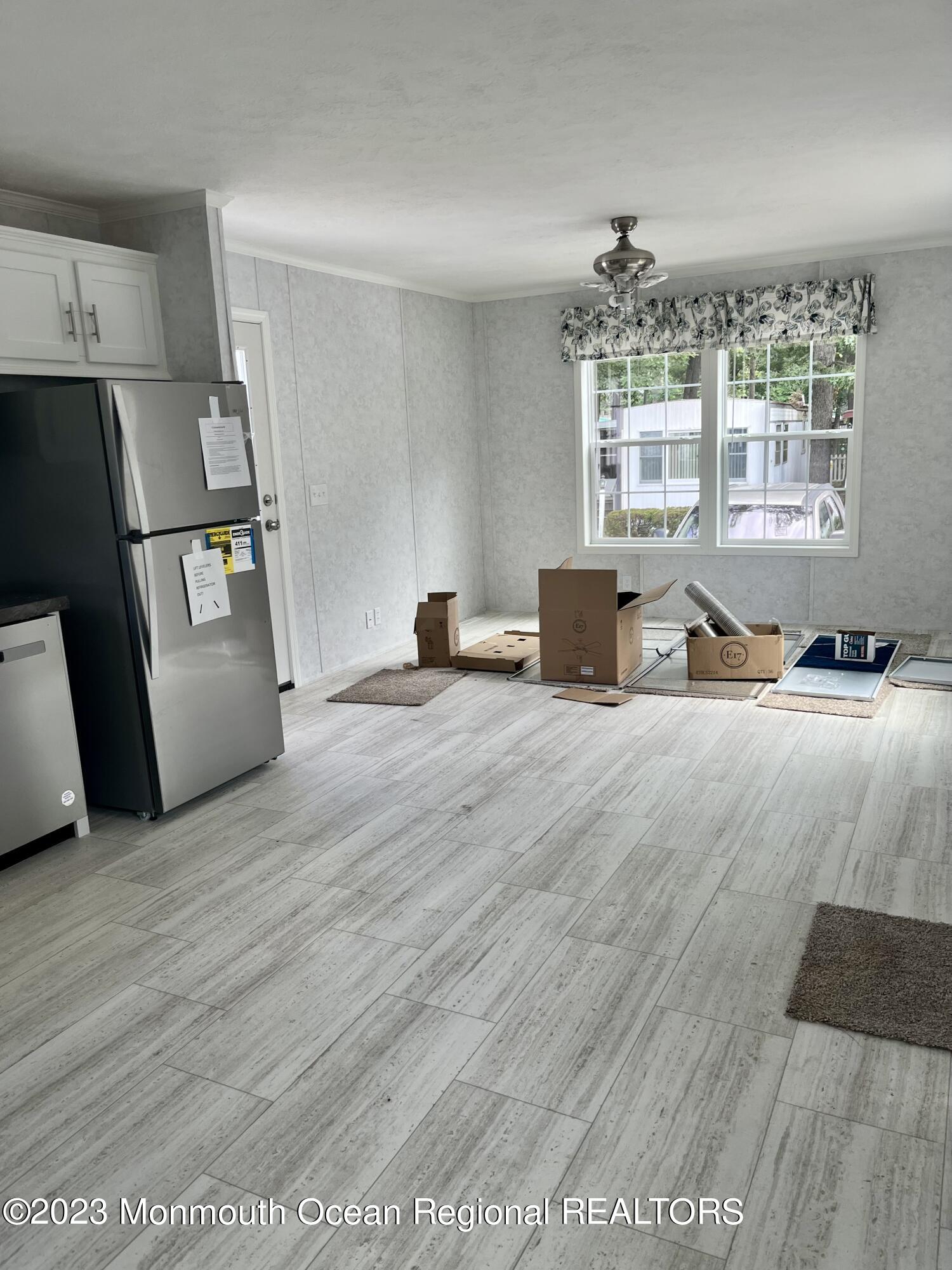 6 C Trail Brick, NJ 08724 - Photo 6 of 17 a bedroom with a bed and wooden floor