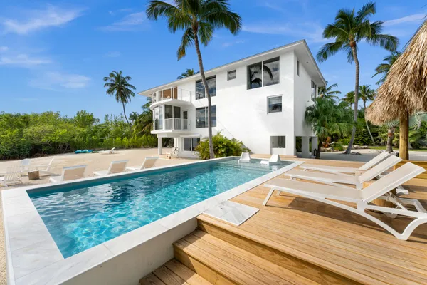 a view of backyard with a patio