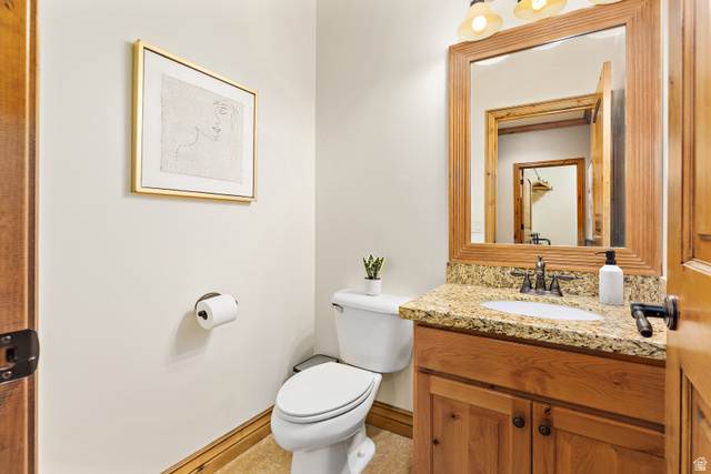 552 East Johns Way Sandy, UT 84070 - Photo 33 of 67 Wood-finish vanity with an undermount sink, granite countertop, and framed mirror