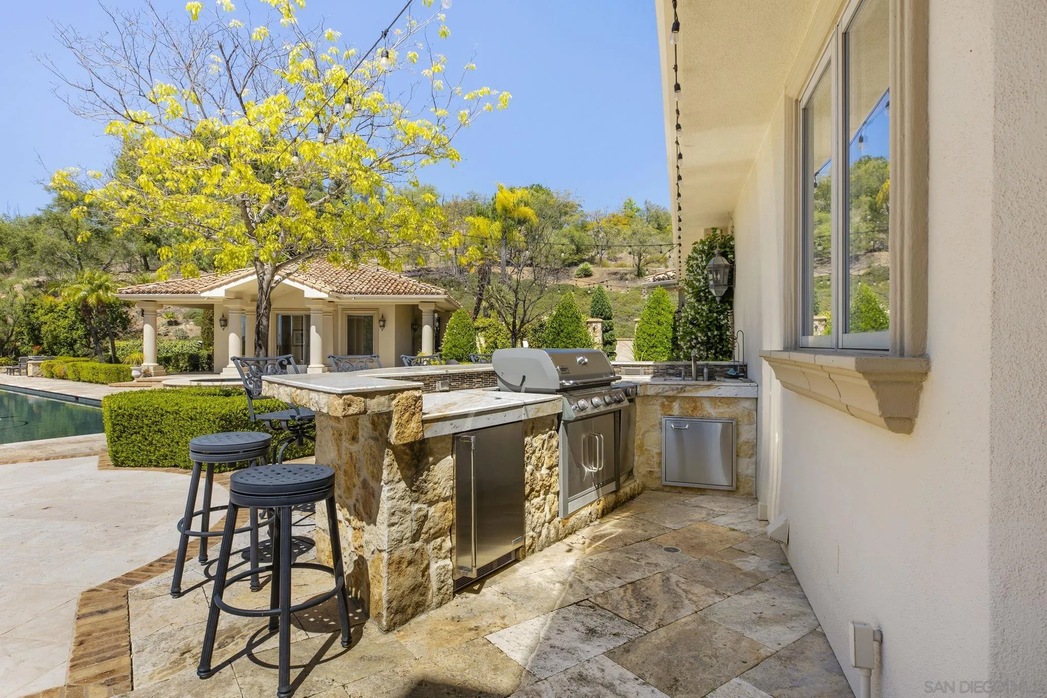 14440 Ridge Ranch Road Valley Center, CA 92082 - Photo 66 of 73 a view of a patio with couches table and chairs and potted plants