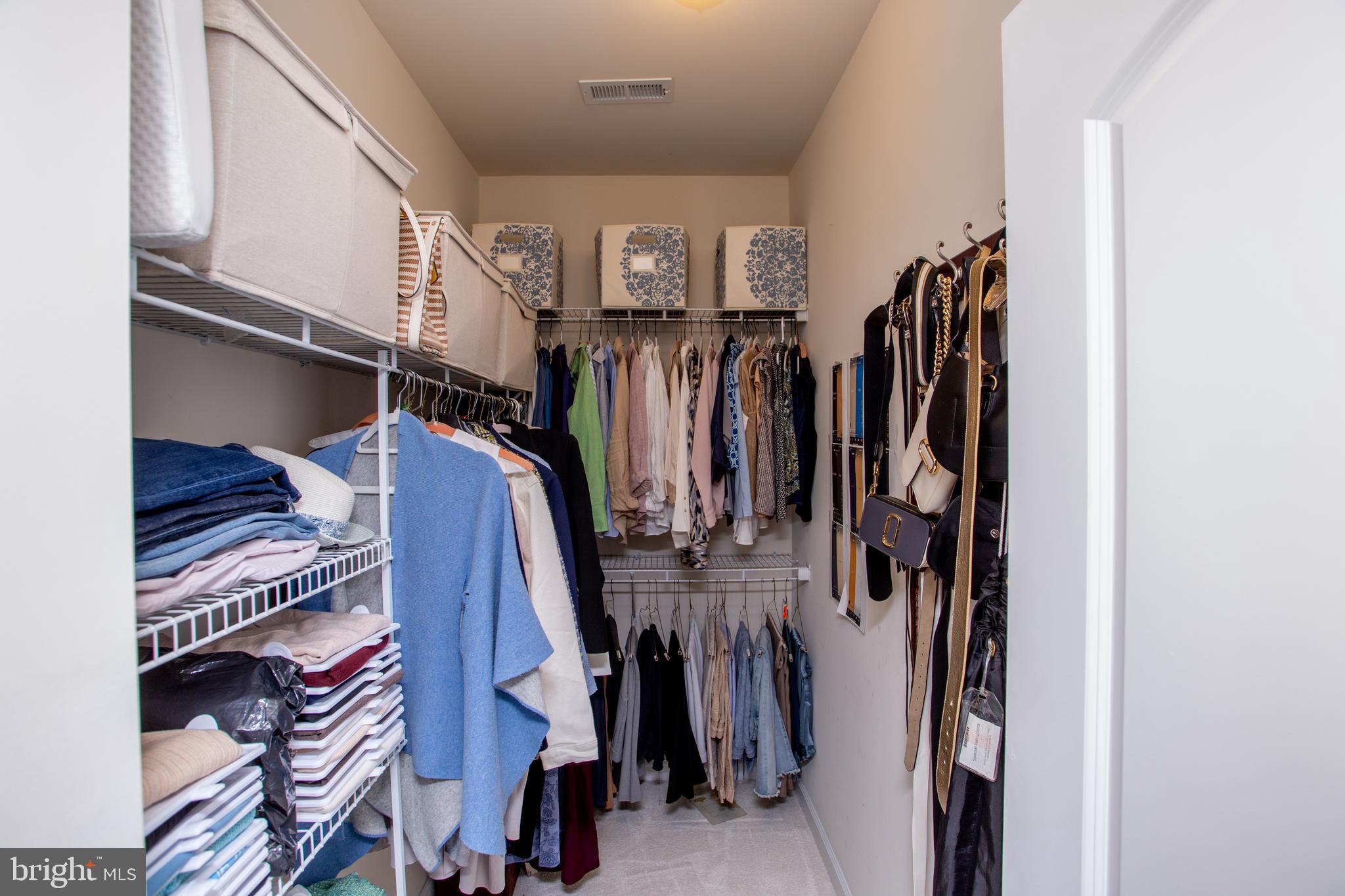 4682 Plough Tavern Road Doylestown, PA 18902 - Photo 21 of 42 a view of walk in closet with clothes and shoes