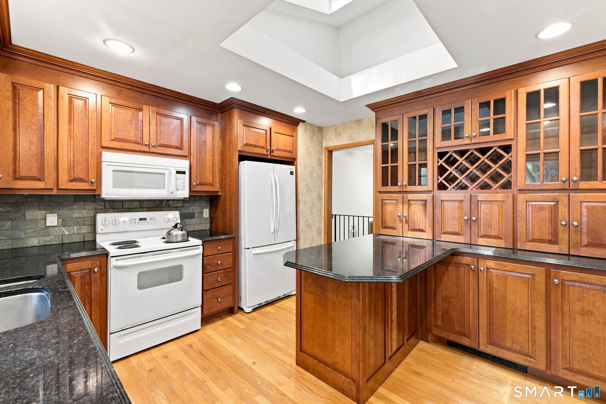 448 Mixville Road Cheshire, CT 06410 - Photo 3 of 32 a kitchen with stainless steel appliances granite countertop a stove a sink dishwasher and a refrigerator