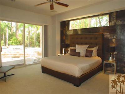 12 Silver Circle Rancho Mirage, CA 92270 - Photo 13 of 24 a bedroom with a bed and glass window