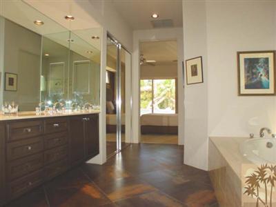 12 Silver Circle Rancho Mirage, CA 92270 - Photo 16 of 24 a bathroom with a sink and a large mirror