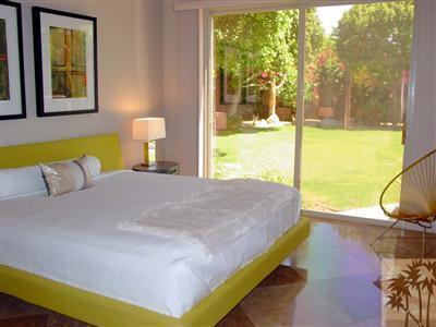 12 Silver Circle Rancho Mirage, CA 92270 - Photo 19 of 24 a bed sitting in a bedroom next to a window