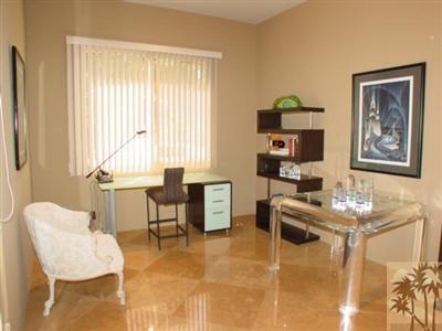 12 Silver Circle Rancho Mirage, CA 92270 - Photo 20 of 24 a living room with furniture and a flat screen tv