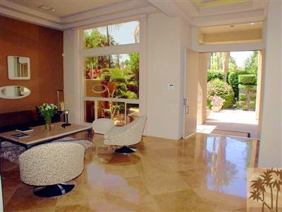 12 Silver Circle Rancho Mirage, CA 92270 - Photo 5 of 24 a living room with furniture and a window