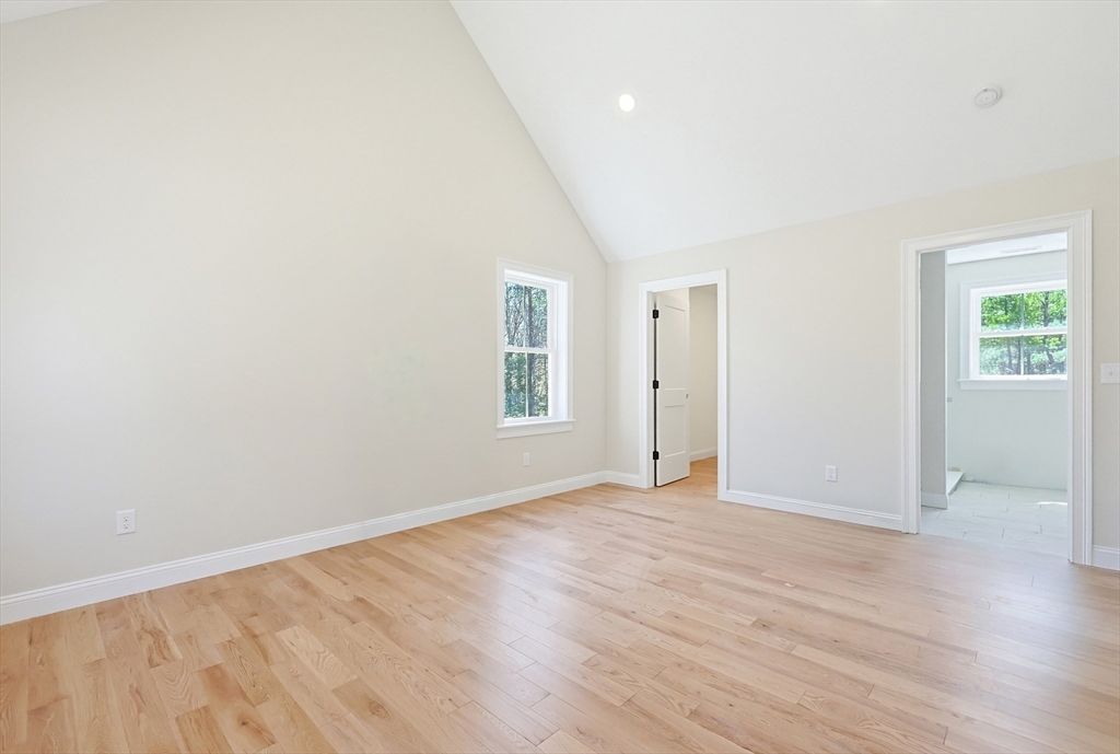 112 West Meadow Road Townsend, MA 01474 - Photo 24 of 38 an empty room with wooden floor and windows