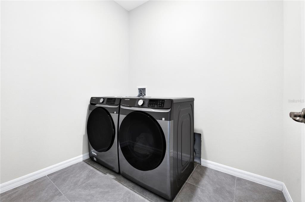 4975 Northwest 39th Loop Ocala, FL 34482 - Photo 39 of 76 a utility room with dryer and washer