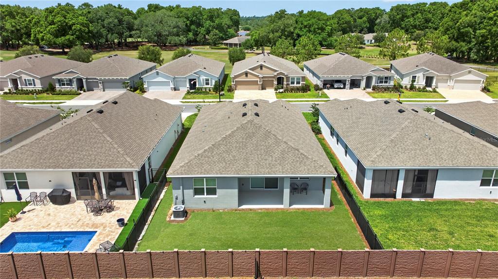 4975 Northwest 39th Loop Ocala, FL 34482 - Photo 40 of 76 a aerial view of a house with swimming pool