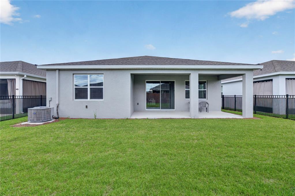 4975 Northwest 39th Loop Ocala, FL 34482 - Photo 45 of 76 a view of a house with a backyard