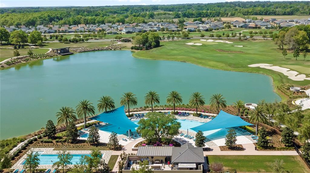 4975 Northwest 39th Loop Ocala, FL 34482 - Photo 51 of 76 an aerial view of residential houses with outdoor space and lake view