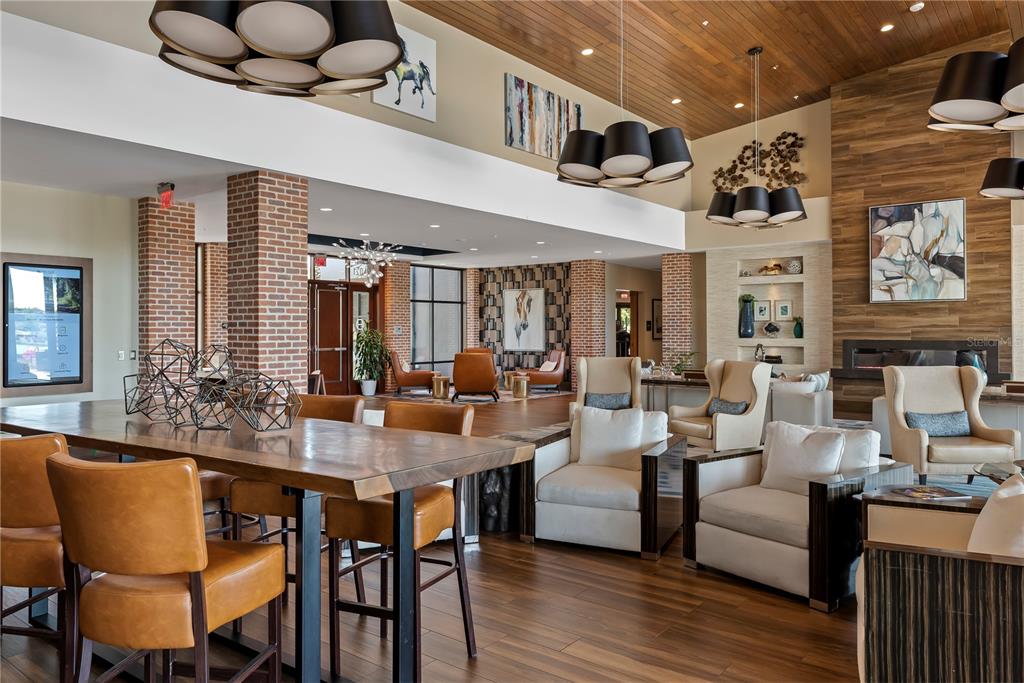 4975 Northwest 39th Loop Ocala, FL 34482 - Photo 73 of 76 a view of a dining room with furniture and wooden floor