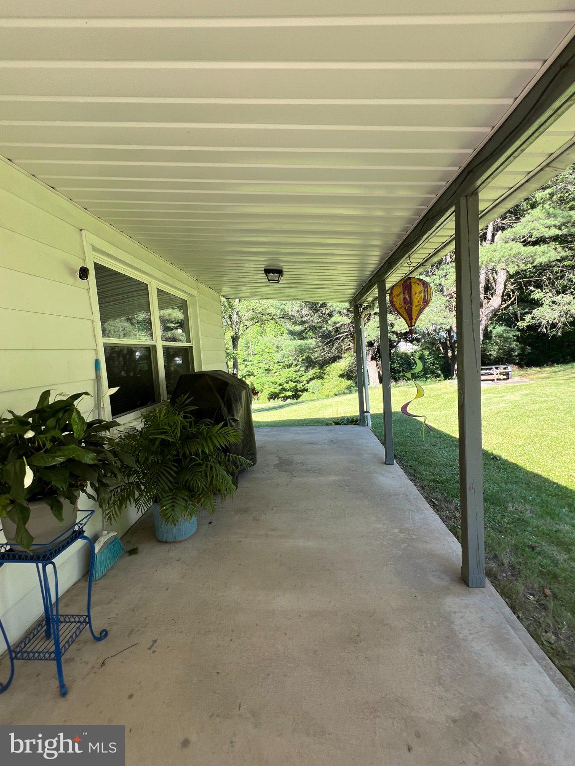 11402 Red Hill Road Southwest La Vale, MD 21502 - Photo 59 of 92 Serene porch with lush greenery views.