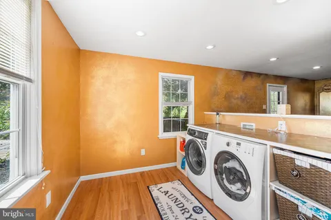 a view of a kitchen with washer and dryer