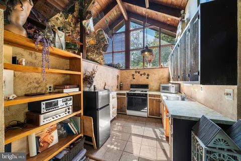 a kitchen with a stove and a microwave