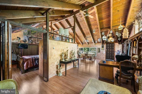 a bedroom with a bed and a mirror