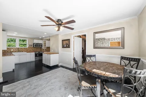 a view of a dining room with furniture and a livingroom