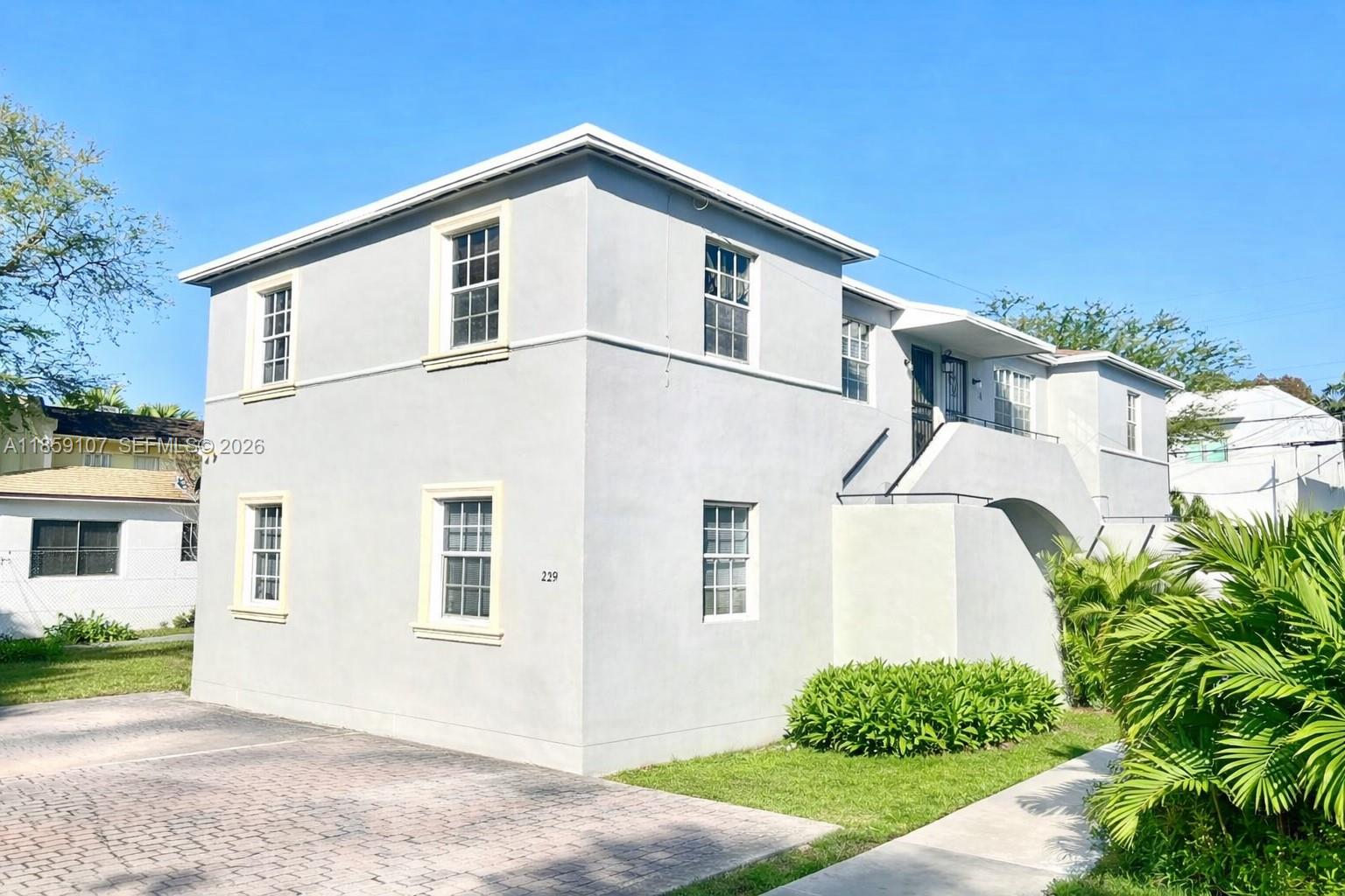 2371 Southwest 27th Street Miami, FL 33133 - Photo 2 of 12 front view of a house with a yard