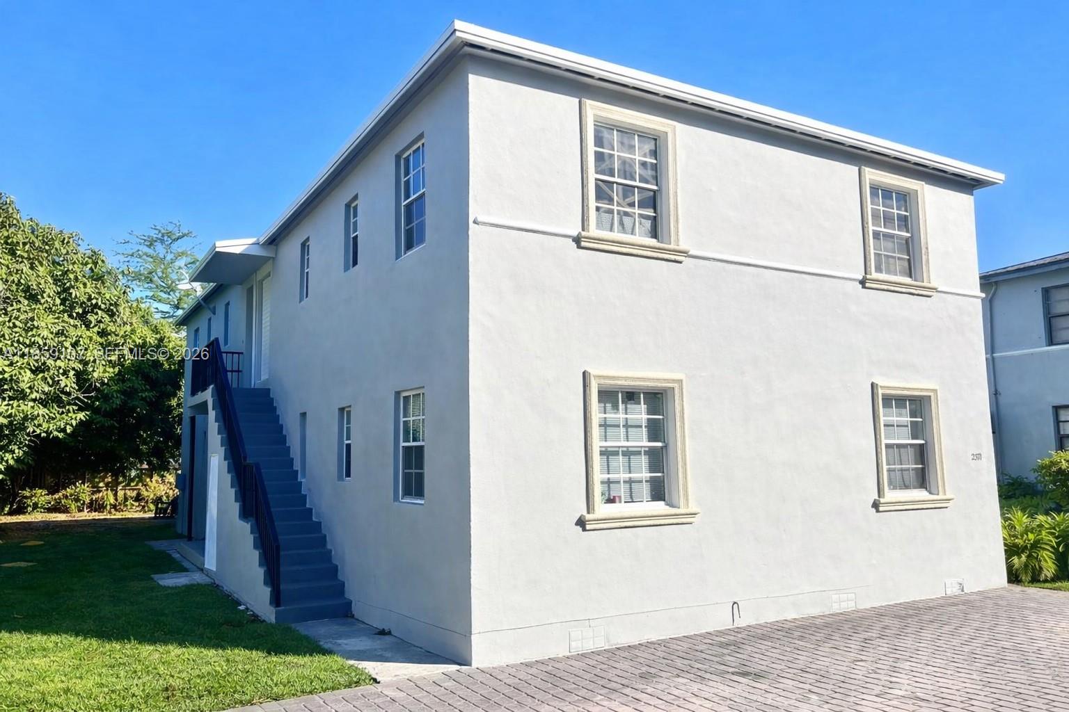 2371 Southwest 27th Street Miami, FL 33133 - Photo 10 of 12 a view of a house with backyard and garden