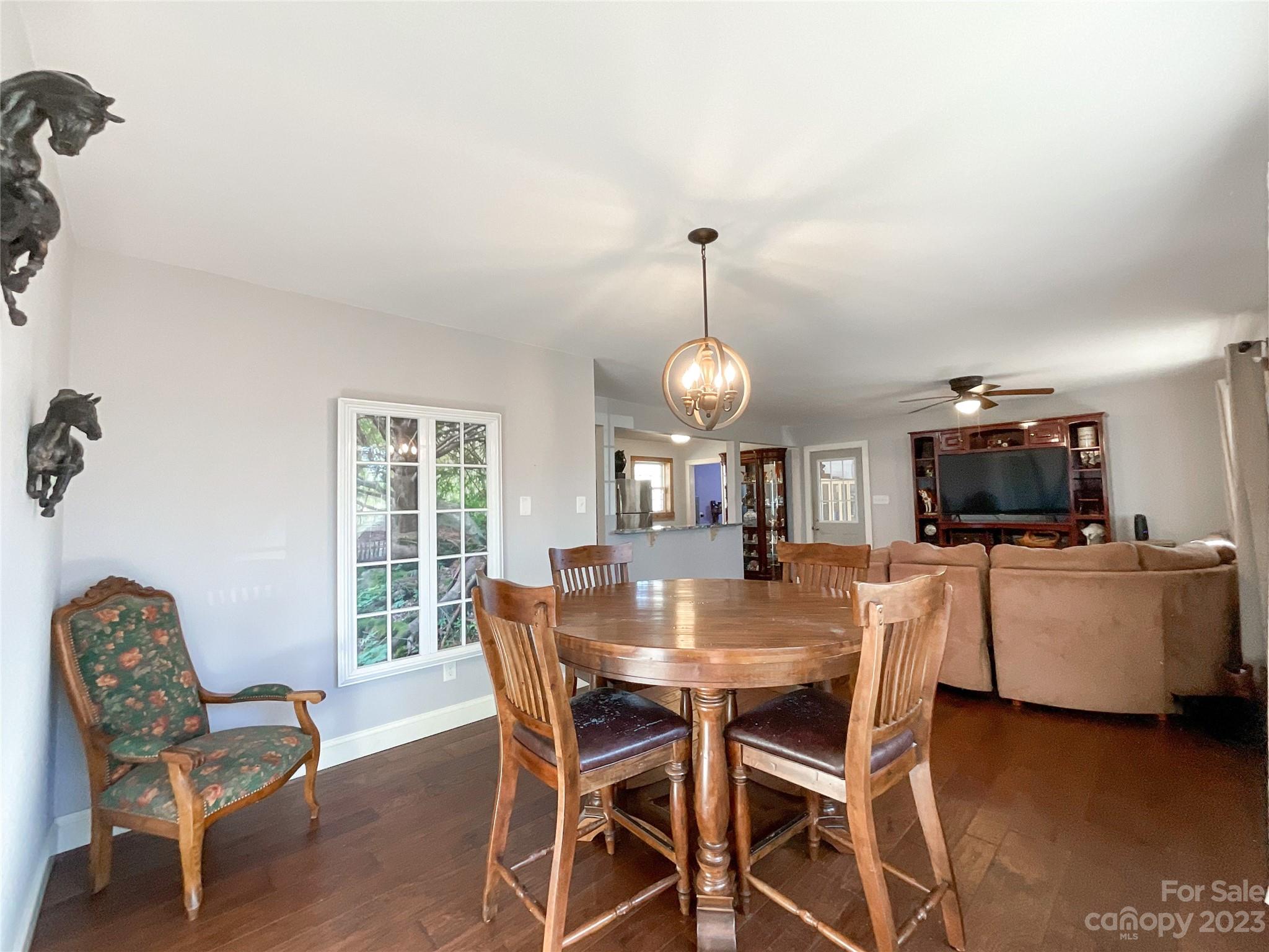 4423 Austin Road Monroe, NC 28112 - Photo 14 of 31 a view of a dining room with furniture and wooden floor