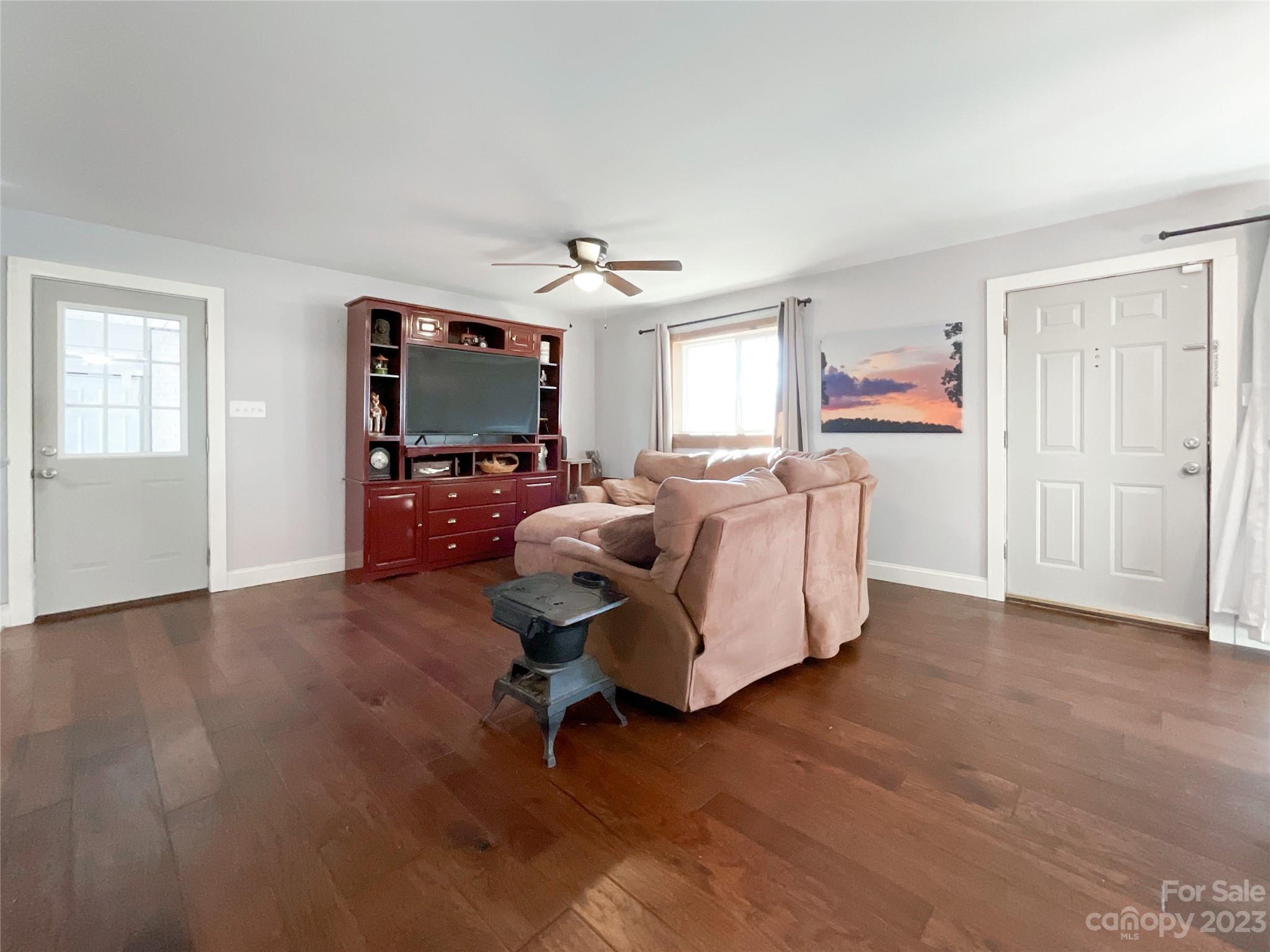 4423 Austin Road Monroe, NC 28112 - Photo 15 of 31 a living room with furniture and a flat screen tv