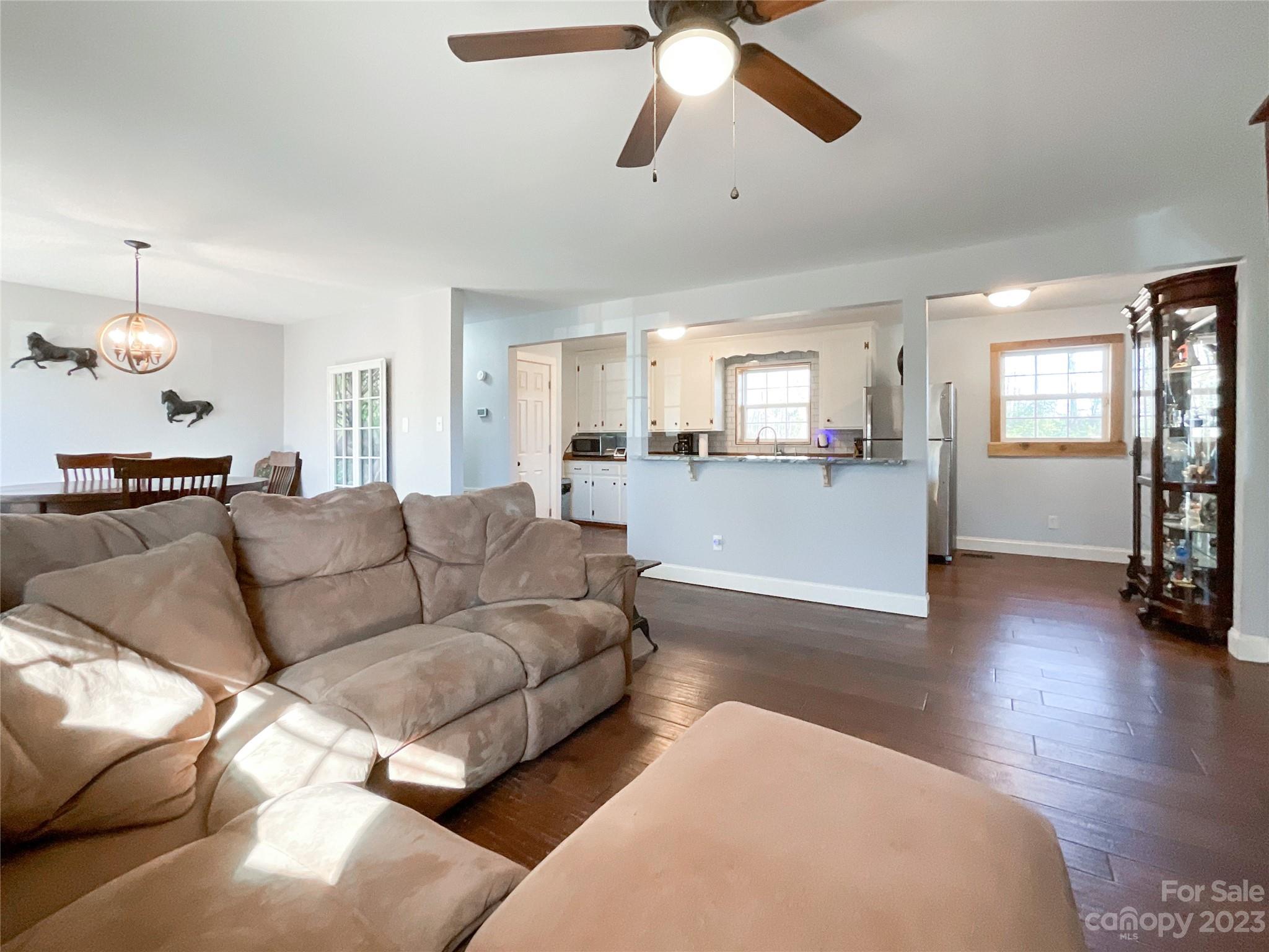4423 Austin Road Monroe, NC 28112 - Photo 16 of 31 a living room with furniture and a wooden floor