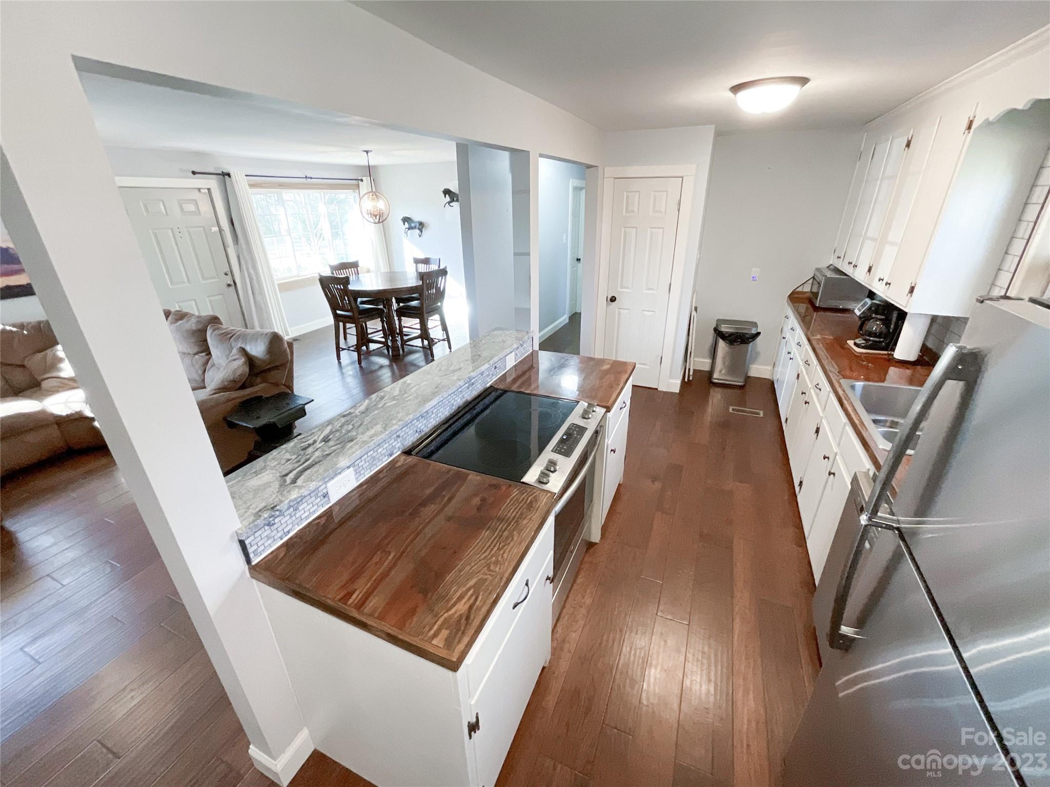 4423 Austin Road Monroe, NC 28112 - Photo 7 of 31 a living room with furniture and a wooden floor