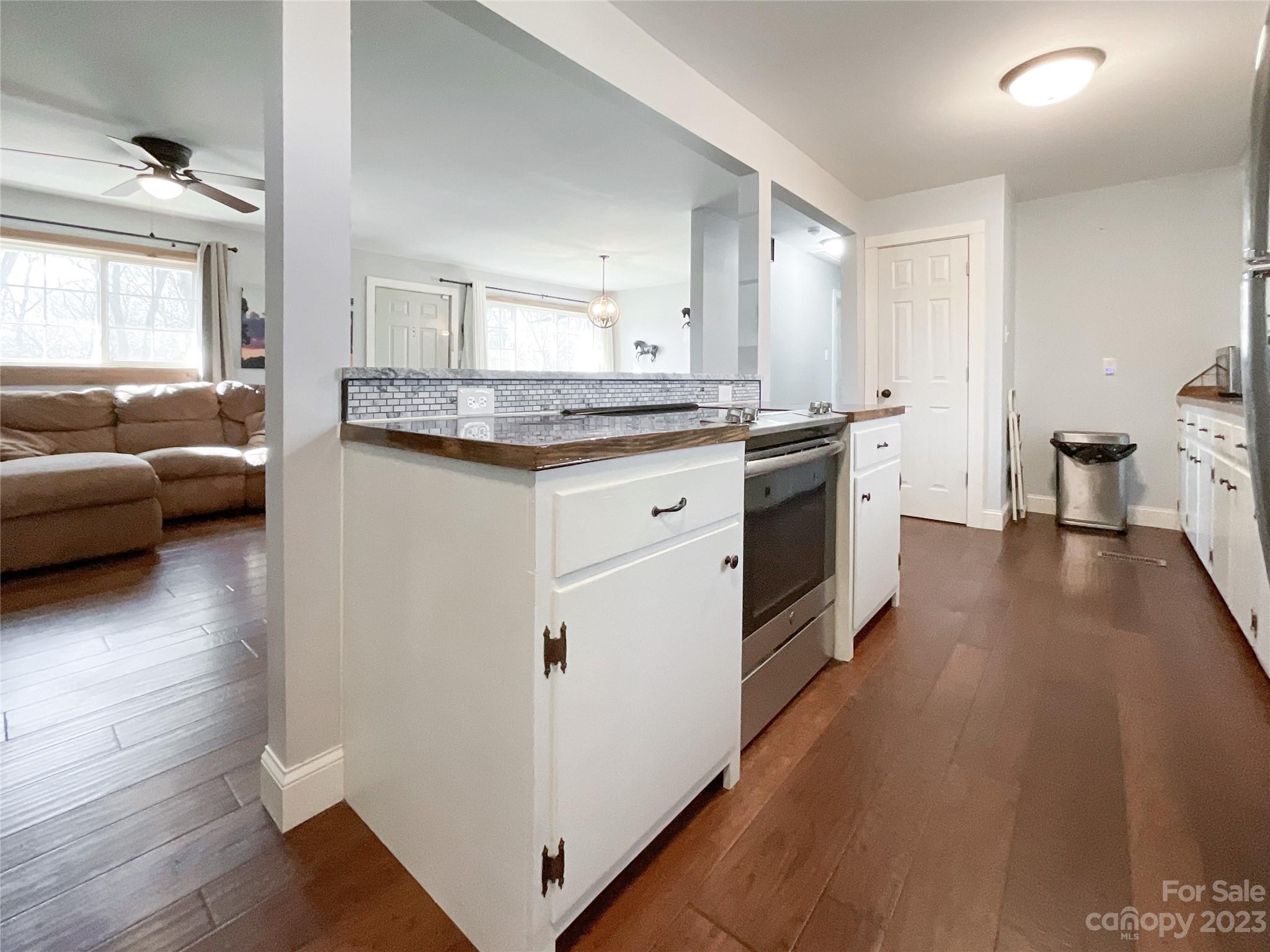 4423 Austin Road Monroe, NC 28112 - Photo 9 of 31 a kitchen with granite countertop a stove and a sink