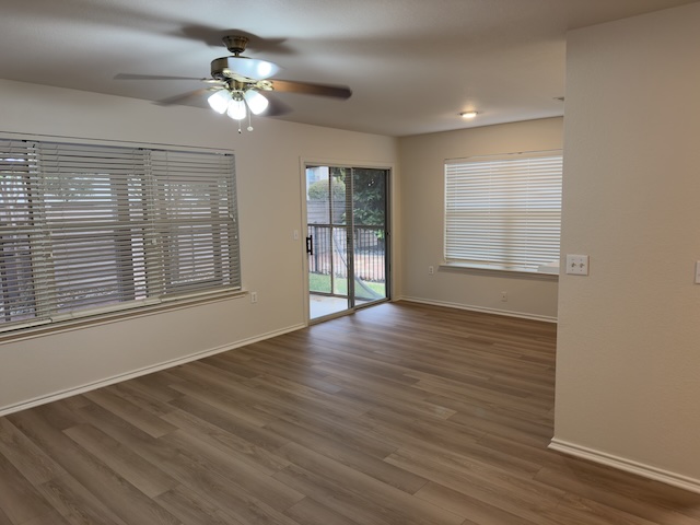 109 Plover Pass Georgetown, TX 78633 - Photo 20 of 25 Spare room with a ceiling fan and dark wood-style flooring